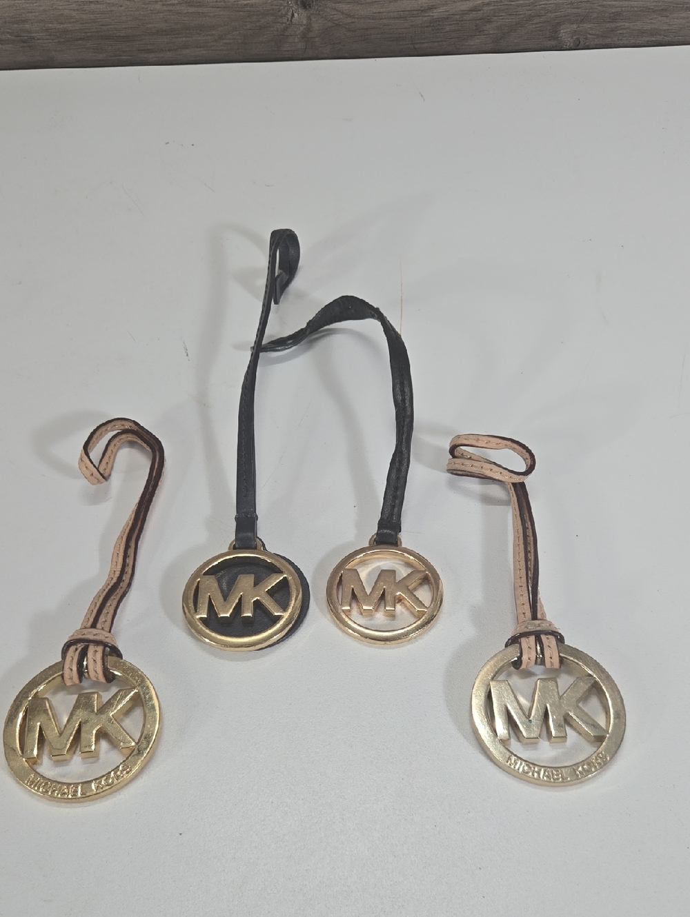 Michael Kors Gold MK Logo Bag Charms with Black and Beige Straps